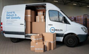 Delivery van loaded with cardboard boxes for global shipping logistics.