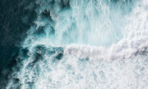 Aerial view of powerful waves crashing in the Atlantic Ocean near Madeira, Portugal.