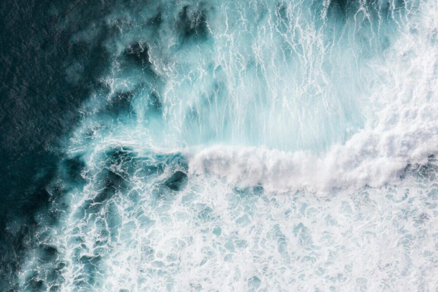 Aerial view of powerful waves crashing in the Atlantic Ocean near Madeira, Portugal.