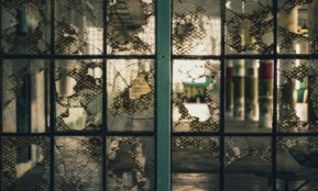 Eerie shot of shattered glass within the historic Alcatraz Prison in San Francisco.