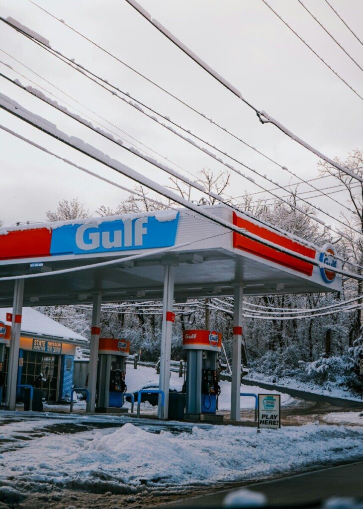 A Gulf gas station surrounded by snow, creating a serene winter atmosphere.