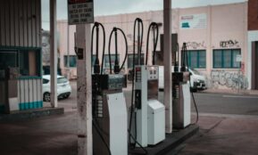 Empty gas station with visible graffiti in Collingwood, Australia.