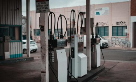 Empty gas station with visible graffiti in Collingwood, Australia.
