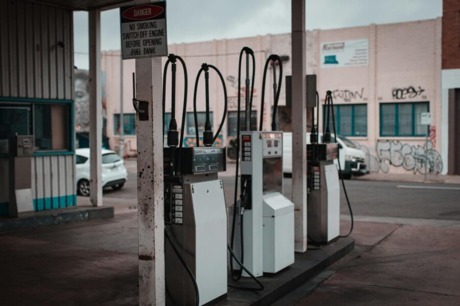Empty gas station with visible graffiti in Collingwood, Australia.