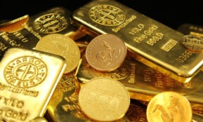 A detailed image of gold bars and coins symbolizing wealth and financial investment.
