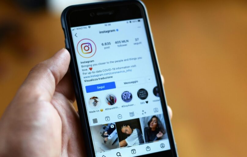 Close-up of a smartphone displaying an Instagram profile screen.