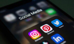 A smartphone screen displaying popular social media applications like Instagram and Twitter.