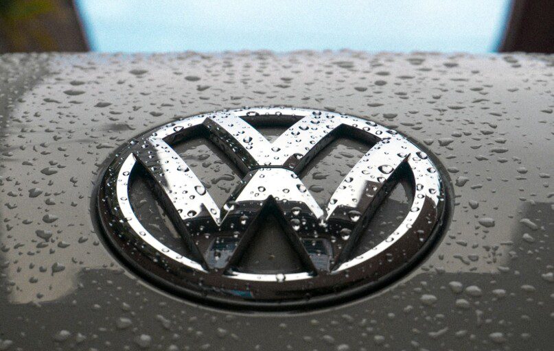 water dew on silver Volkswagen car emblem