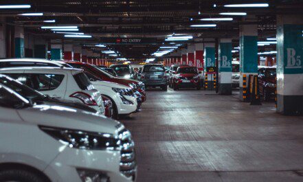 different vehicles parking on garage area of the building