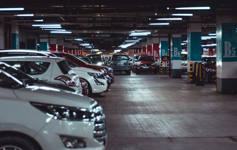 different vehicles parking on garage area of the building