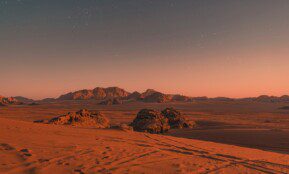 brown sand under blue sky during night time