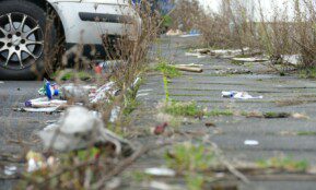 a white car parked on the side of a road