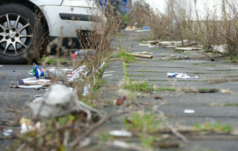 a white car parked on the side of a road