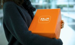 Woman holding an orange temu package