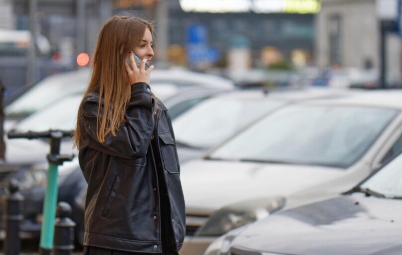 woman, talking, phone, outdoors, street, urban, cars