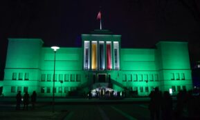 a large building with a flag on top of it