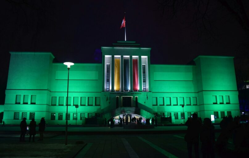 a large building with a flag on top of it