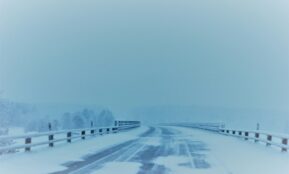 snow covered empty road
