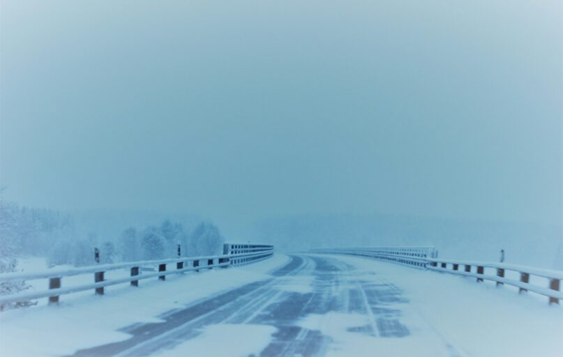 snow covered empty road