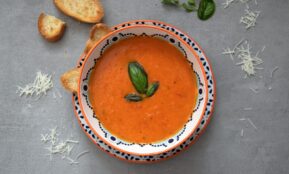 brown soup on white and blue ceramic bowl