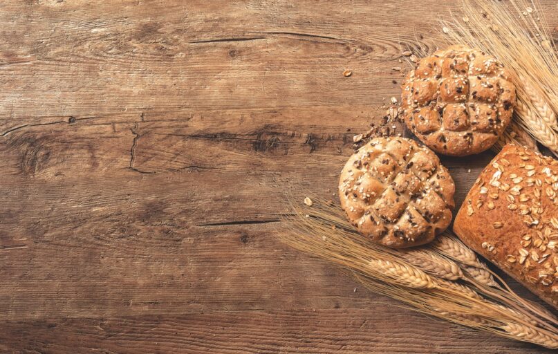 cookies, bread, and wheat on table