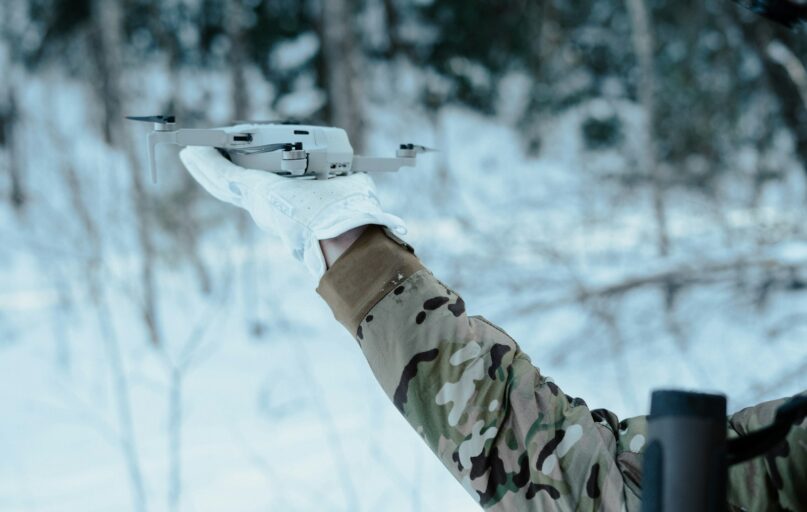 a person holding a drone