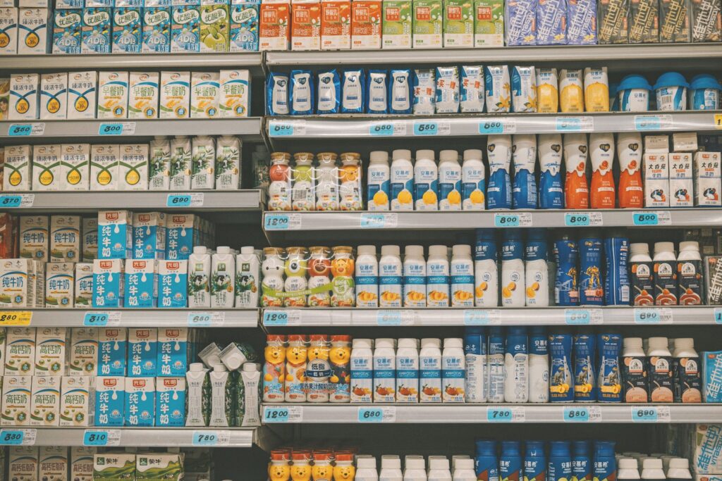a display in a grocery store filled with lots of milk