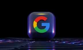 a close up of a computer keyboard with a google logo on it