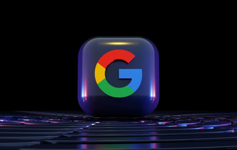 a close up of a computer keyboard with a google logo on it