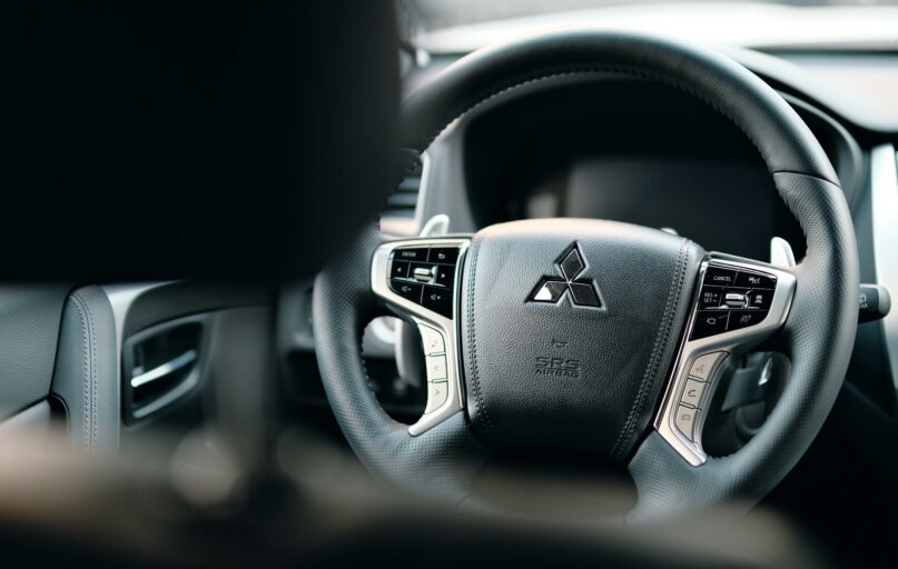 black honda steering wheel in close up photography