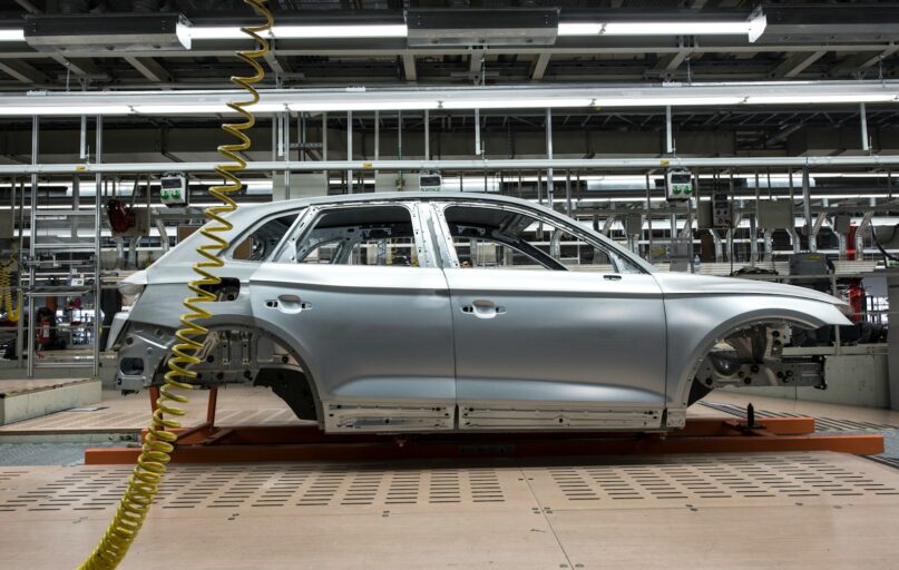 white sedan on a parking lot