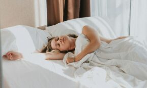 a person lying in a bed