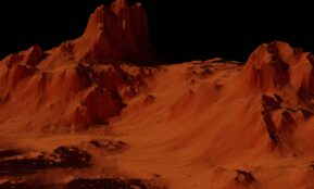 a group of mountains covered in sand at night