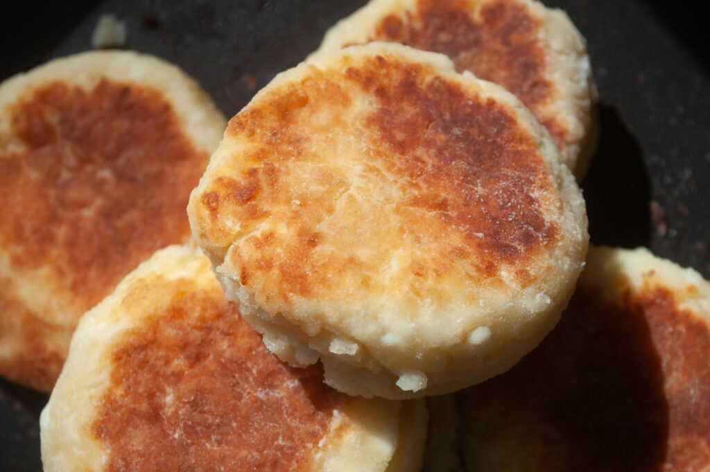 Golden brown cheese pancakes stacked together