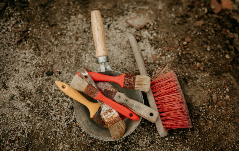 a bucket filled with different types of tools