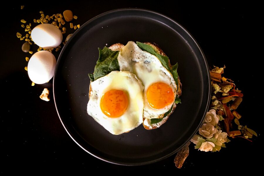 sunny side up egg on black ceramic plate