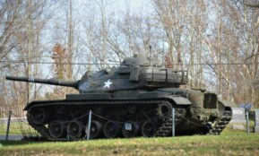 a truck that is sitting in the grass