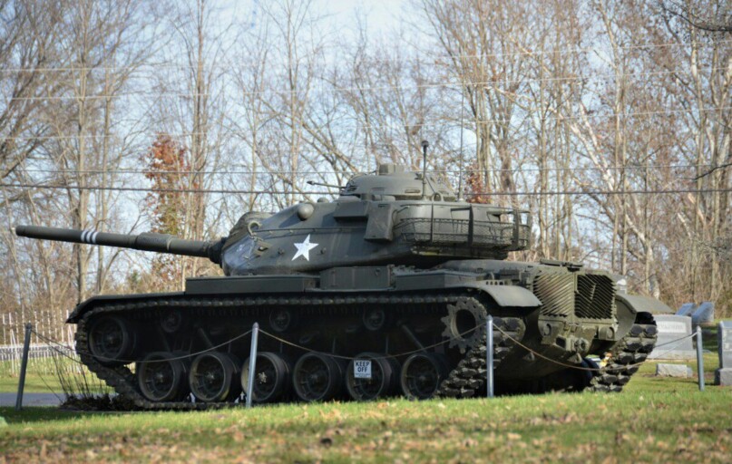 a truck that is sitting in the grass