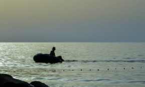 A person on a boat in the water