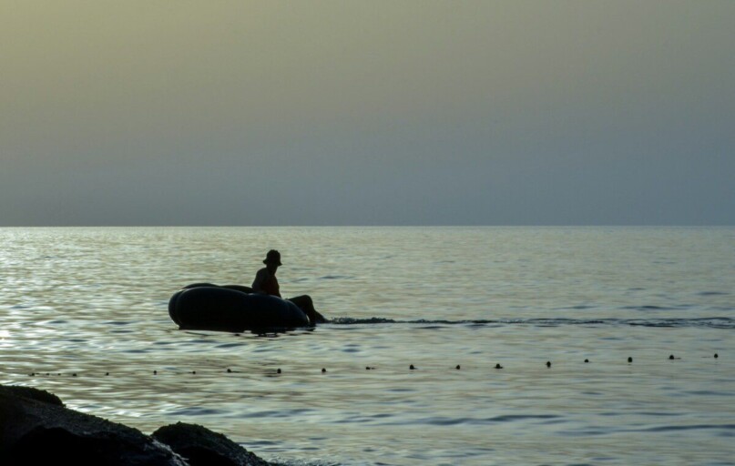A person on a boat in the water