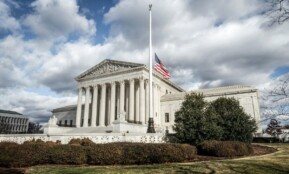 a large building with a flag on top of it