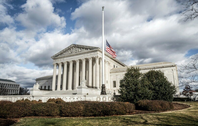 a large building with a flag on top of it