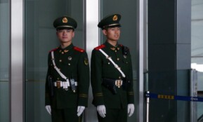 man in black and brown camouflage uniform