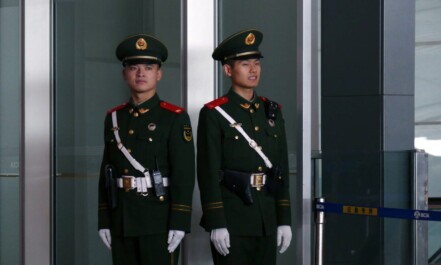 man in black and brown camouflage uniform