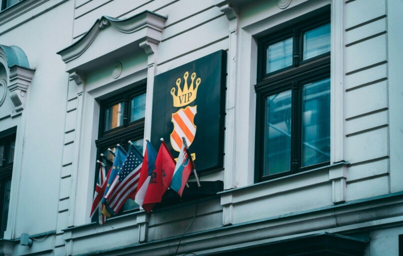 a group of flags on a building