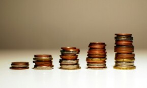 Stacks of coins increasing in height from left to right.