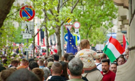 a crowd of people walking down a street