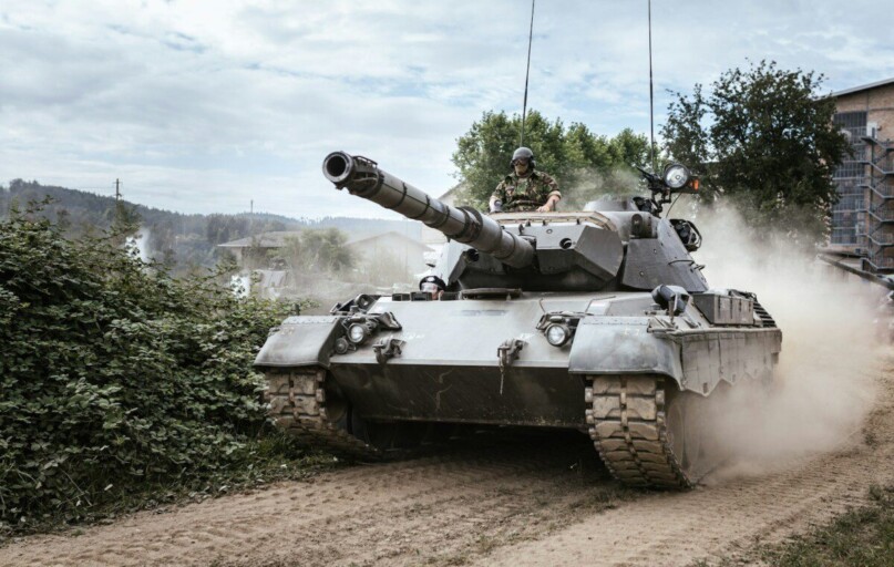 battle tank on green grass field during daytime