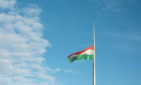 a flag is flying high in the sky