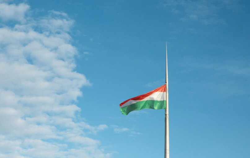 a flag is flying high in the sky